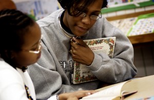 classroom aide helping student as part of their special education IEP program